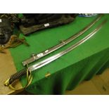 A reproduction cavalry officer's sword in scabbard