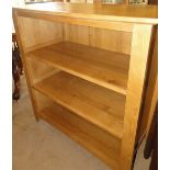 A modern oak open bookcase.