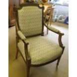 A French stained beech open armchair with fluted legs.