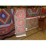 A Tribal bagface 46cm x 67cm, Bokara rug, 66cm x 95cm and an Isbeuk runner, 33cm x 140cm,