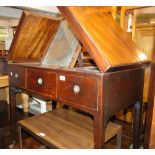 A 19th century mahogany campaign wash stand, having rising lid with sliding and fitted interior,
