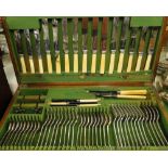 An oak canteen of cutlery for 8 people,