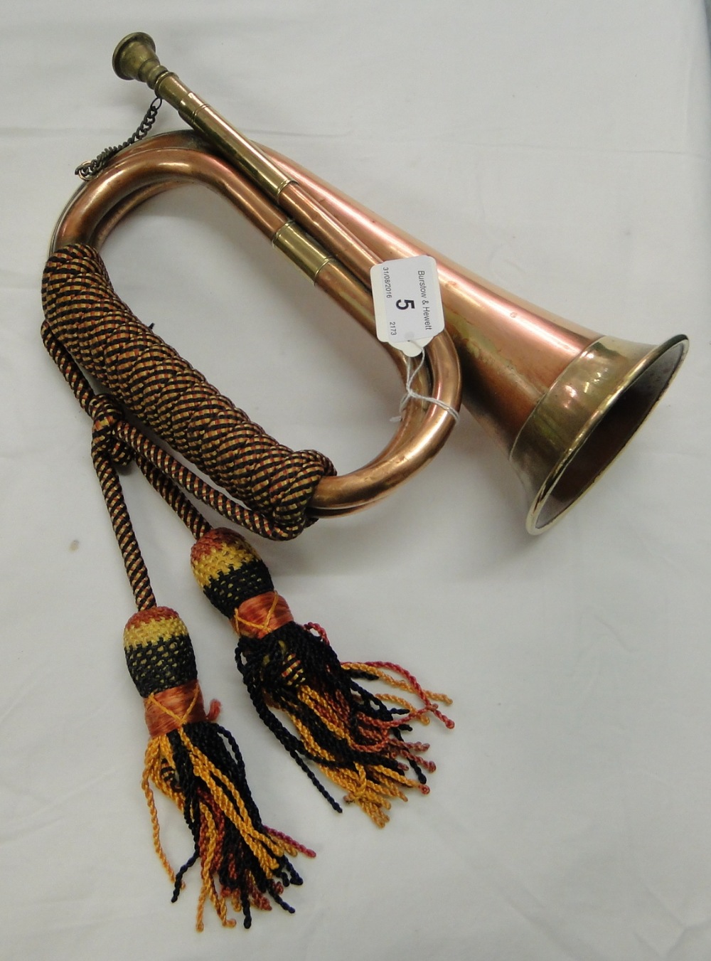 A copper and brass bugle.