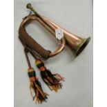 A copper and brass bugle.