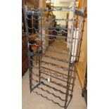 A black painted wrought-iron 72 bottle wine rack.