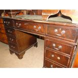 A reproduction mahogany twin pedestal writing desk.