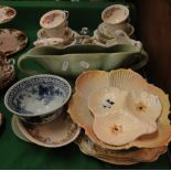 A teaset, vase, and various plates.