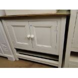 A painted pine 2-door cabinet with open shelves under.