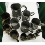 Various 19th century pewter measures and side pouring jugs, and Victorian brass measures.