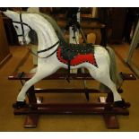 A Painted rocking horse on stand