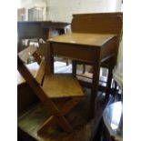 A child's pitch pine desk and matching chair.