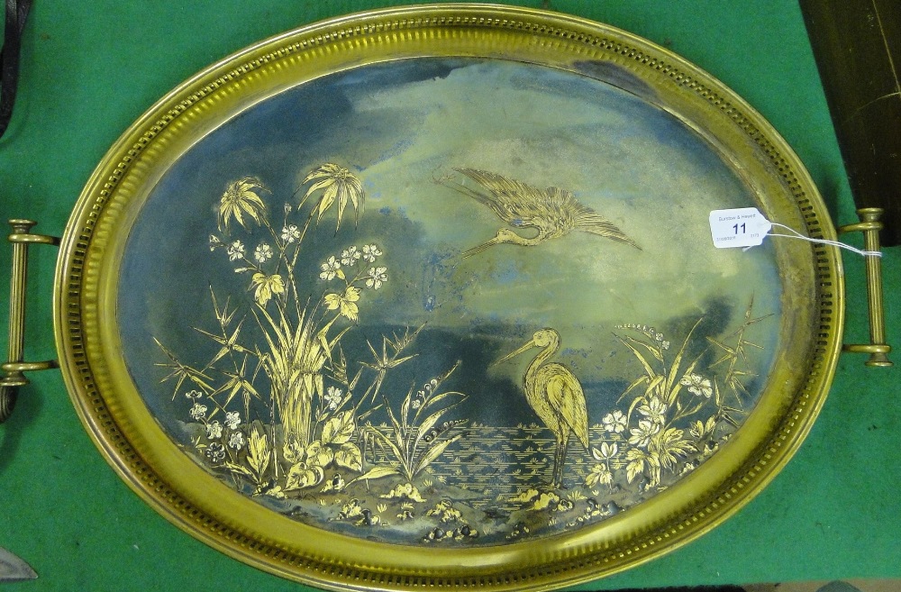 A chinoiserie decorated tea tray with pierced brass gallery.