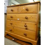 A modern pine 5 drawer chest.