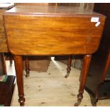 A small Victorian mahogany drop leaf work table, with single drawer and turned legs.