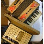 A Hohner student's piano accordion & a radio