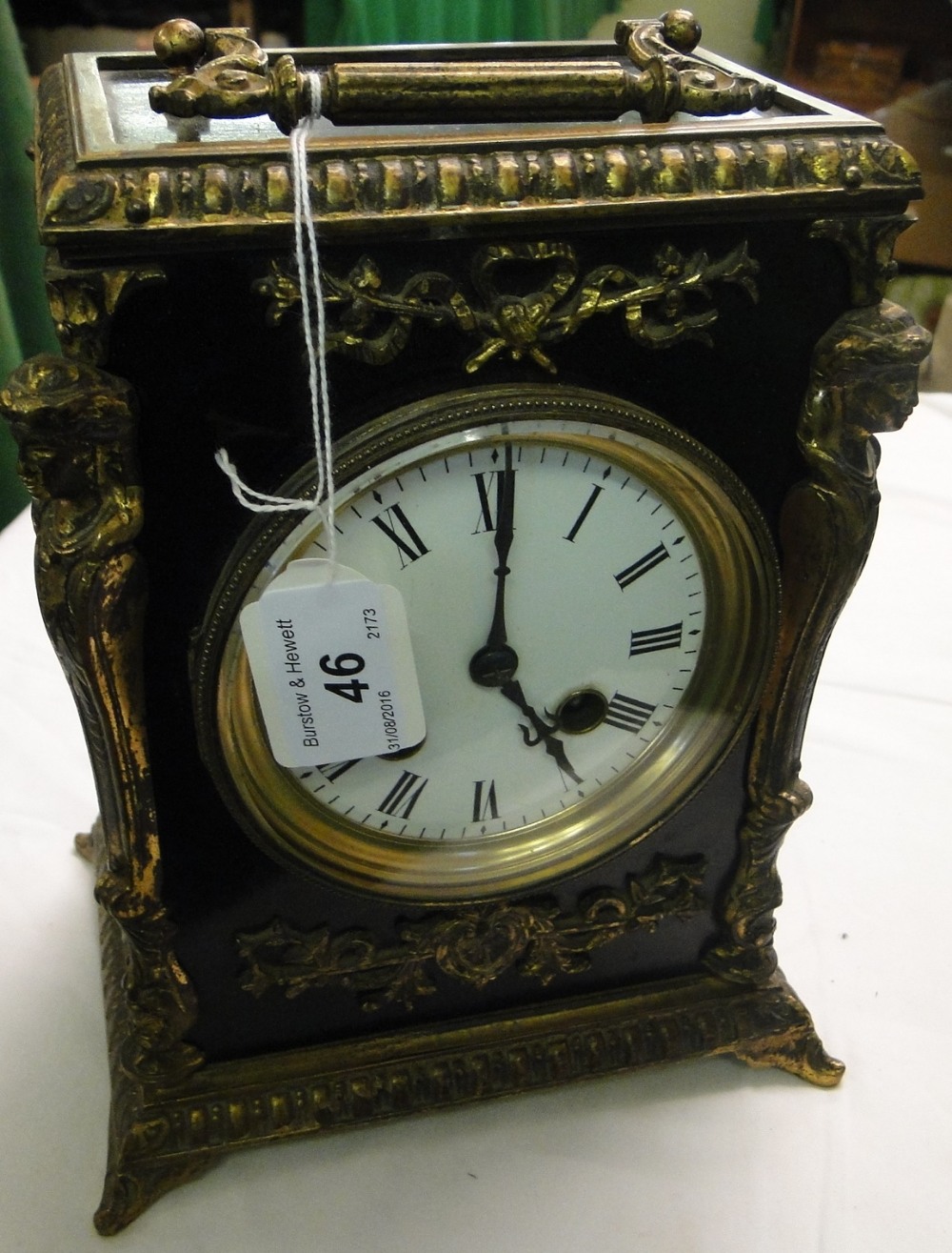 A 2-train carriage clock with ormolu mounts.