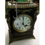 A 2-train carriage clock with ormolu mounts.