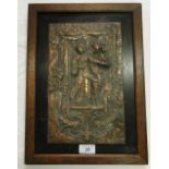 An embossed copper plaque depicting Medieval dancing figures, mounted in oak frame, height 15.
