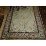 Green ground Persian design rug with blossom tree decoration,