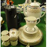 A Wedgwood coffee set in "Harlequin," pattern, a black Basalt Ware teapot and hot water jug.