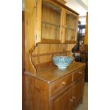 A modern polished pine dresser.