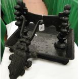 A cast-iron boot scraper and a beetle design boot jack.