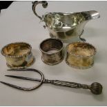 A Silver cream jug, 3 silver napkin rings 5.