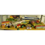 Vintage tinplate toys, including boxed Milky Way boat and a Zetor tractor and trailer.