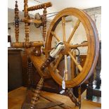 A Vintage oak and elm spinning wheel.