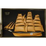 A carved wood relief plaque depicting "The Cutty Sark.