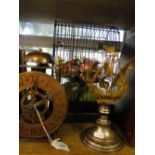 Ornamental bird cage, filigree ship, a clock, etc.