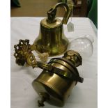 A brass bell with mount and a gimballed brass bulk head lamp.