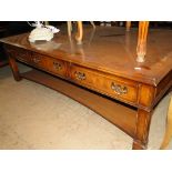 A large rectangular mahogany coffee table with 6 short drawers.