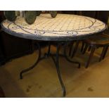 A Blue & white mosaic topped garden table on folding metal base