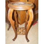 A French stained beech and marble top jardiniere stand.