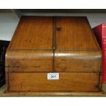 A mahogany table top stationery cabinet.