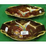 A pair of Carltonware "Rouge Royale" dishes with painted ducks.