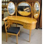 A satin walnut kidney shaped dressing table with triple mirror,