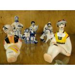 A pair of coloured USSR seated figures, and blue and white figures.