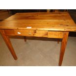 A rectangular pine coffee table with single drawer.