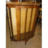 1930s walnut serpentine front display cabinet