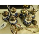 Pair of plated condiment sets with blue & white bottles, sifter spoon,