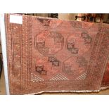 A Red ground Balochi rug