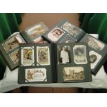 Three postcard albums containing over 700 mixed Vintage cards.