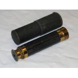 A Small cased vintage brass telescope