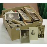 A box with a large amount of ephemera including photos,