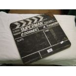 A film clapper board inscribed "Superman.