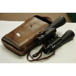 A pair of leather cased First World War military binoculars by Jules Huet, Paris.