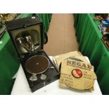 A Decca Junior portable record player with assorted 78 rpm records.