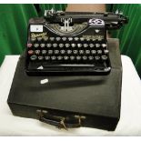 An early portable typewriter by Rheinmetall in original case.